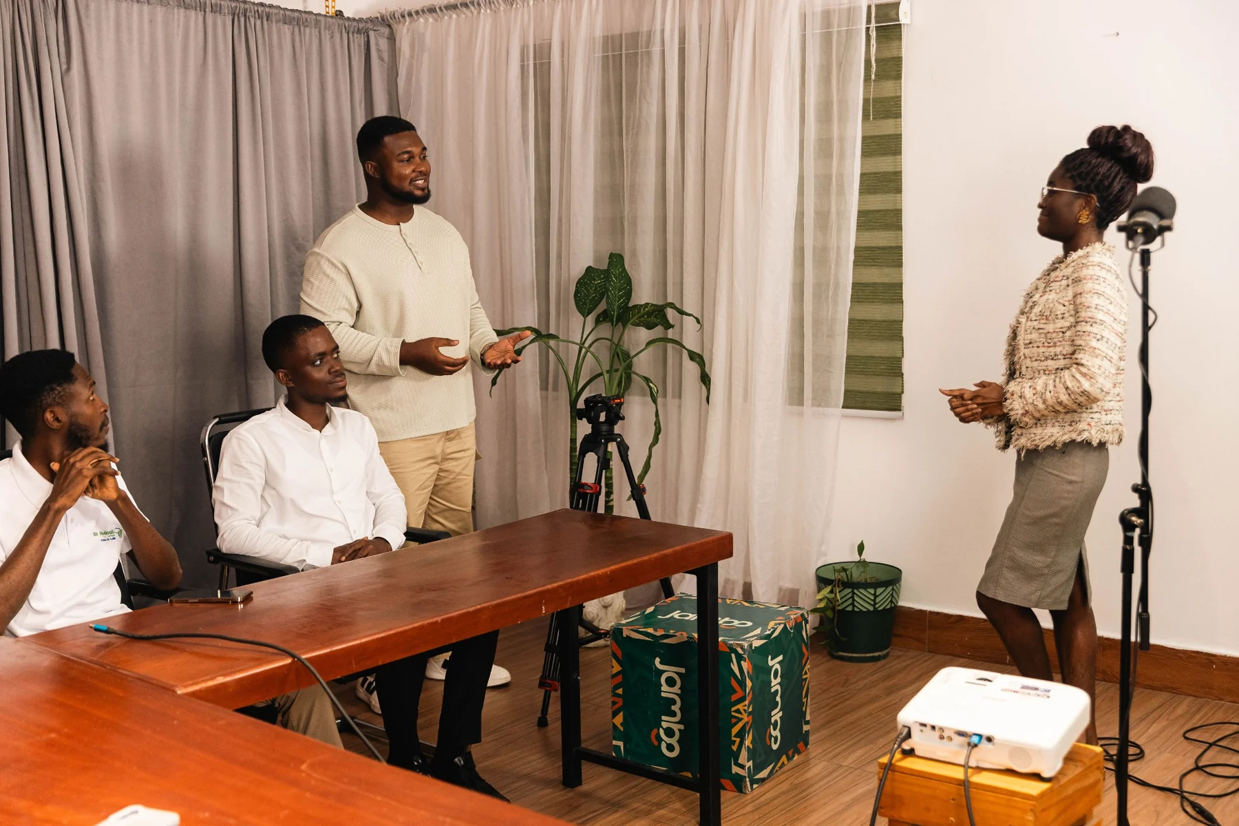 Participants observing and taking part in a coached speaking exercise